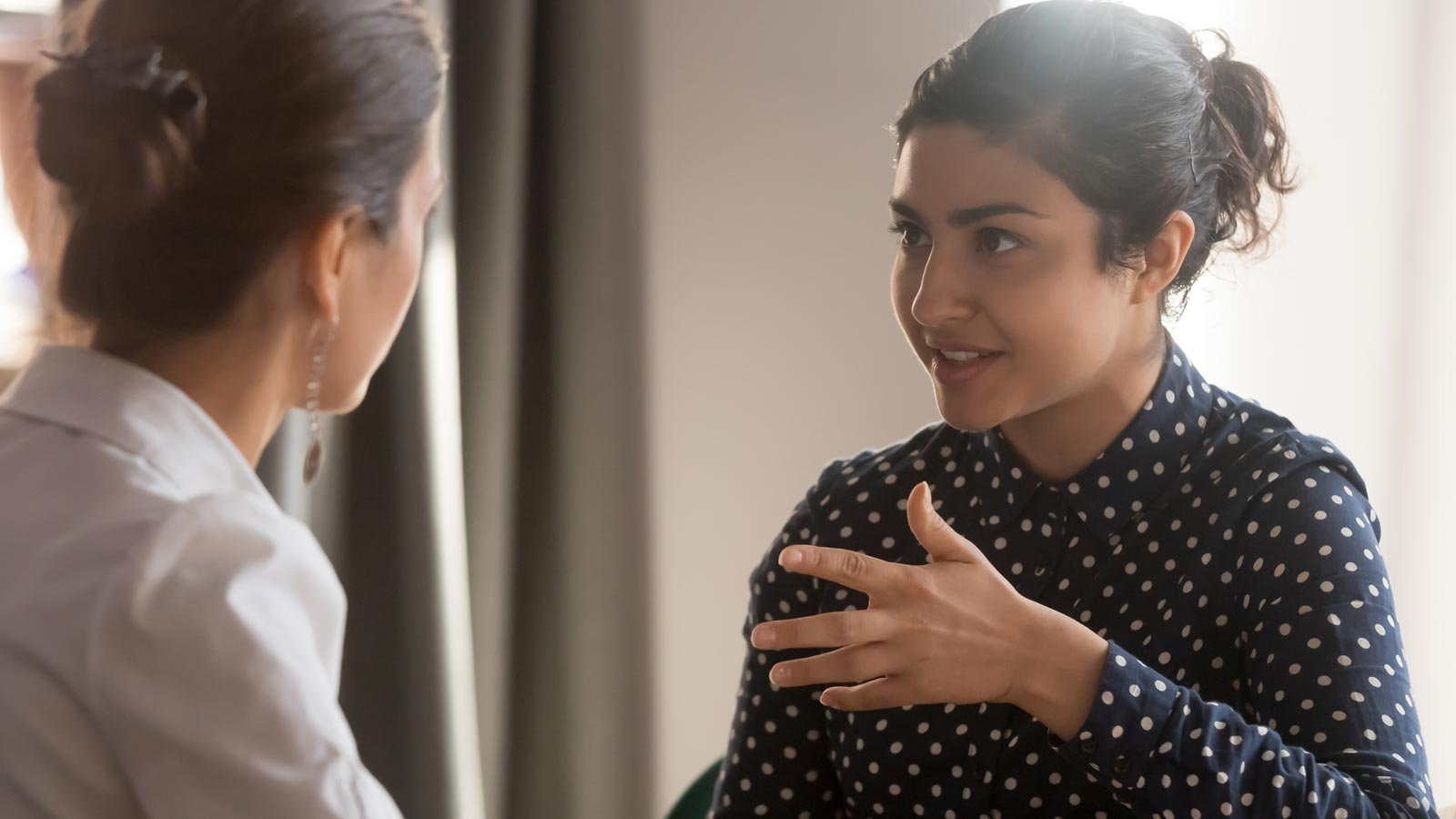 Two young women having a conversation